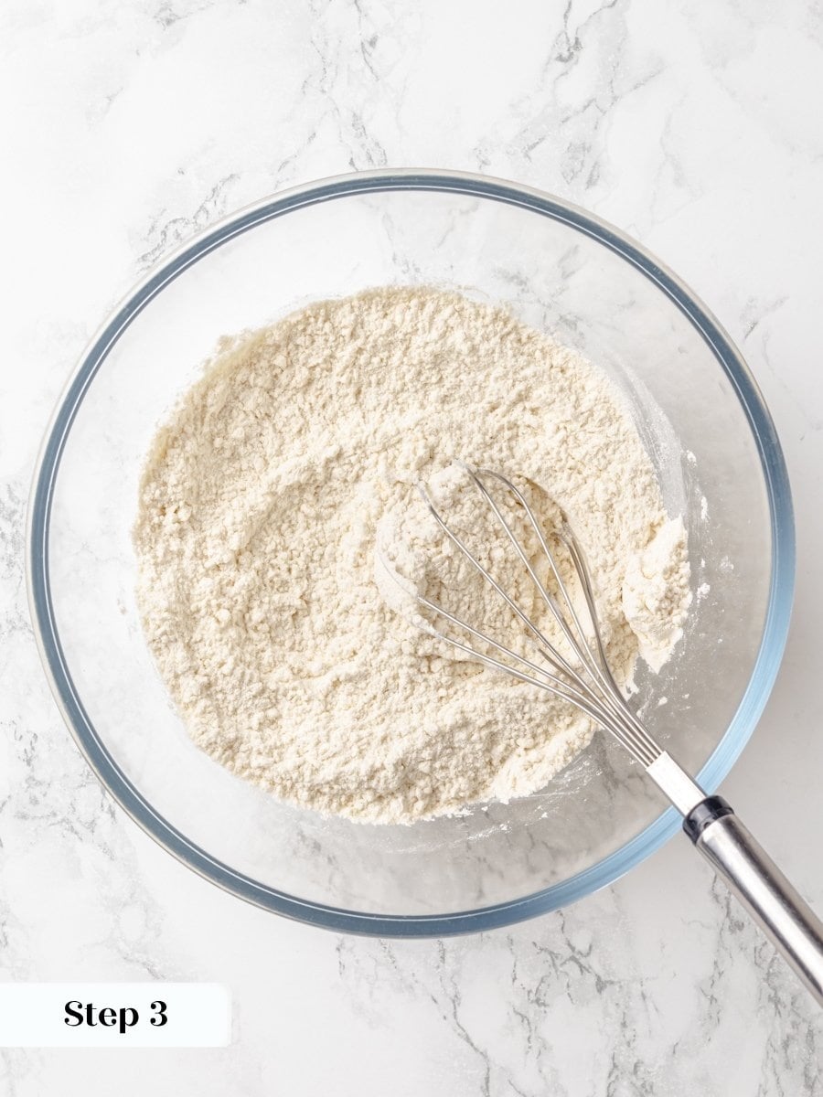 Whisking the dry ingredients first keeps the crumb cake tender rather than dense or unevenly risen.