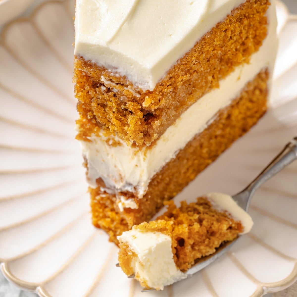 The tight, even crumb here is the clearest proof of this pumpkin cake's lasting moisture.