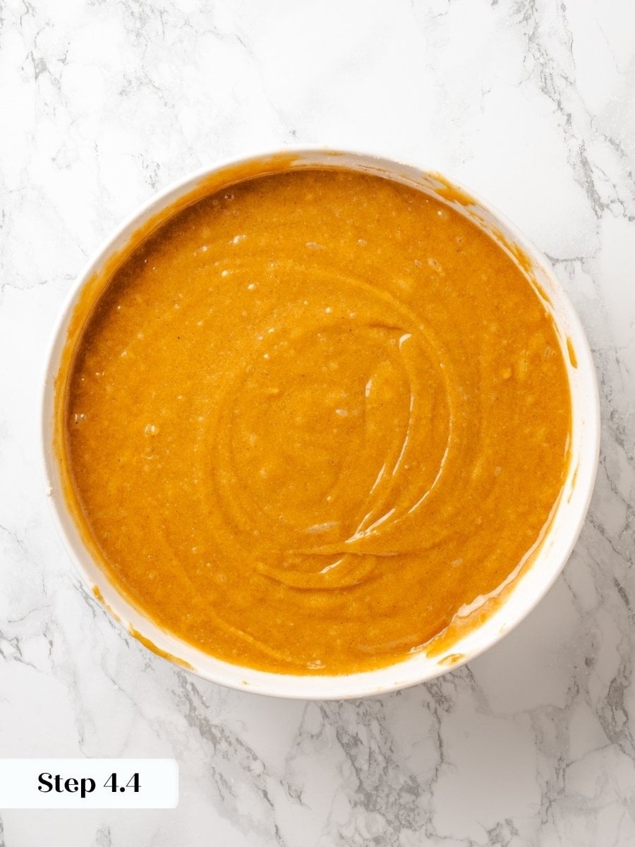Stopping at a few lumps keeps the pumpkin cake tender instead of toughening the delicate crumb.
