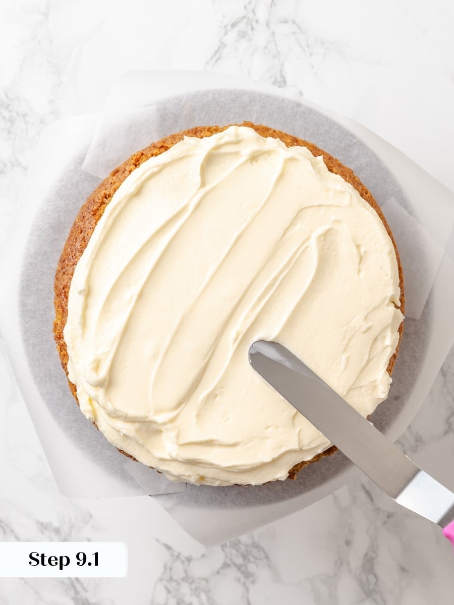 A generous, level layer of buttercream between tiers keeps the finished pumpkin cake stable and even.