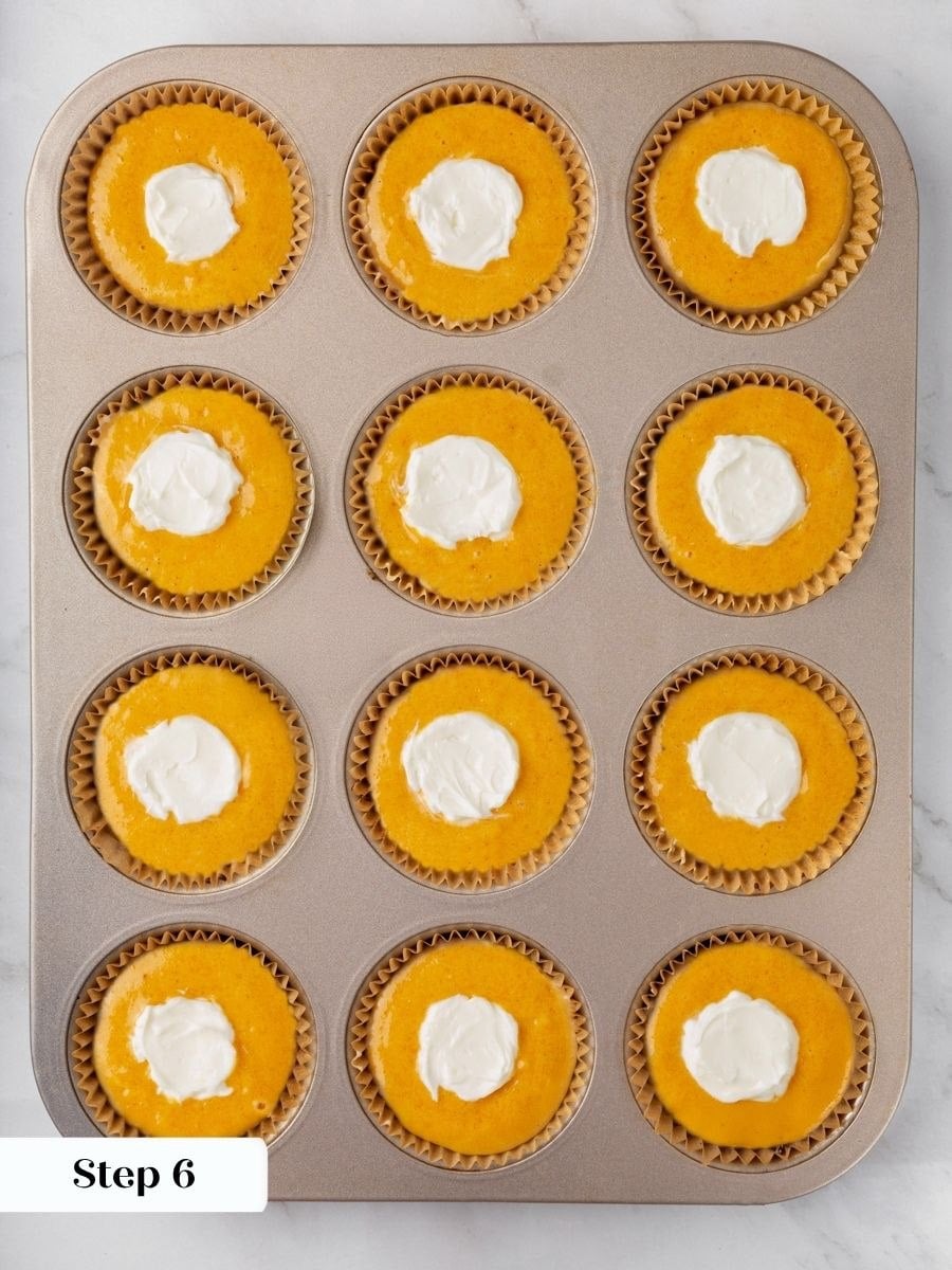 Pressing the scoop into the centre gives pumpkin cream cheese muffins their distinct baked layer.