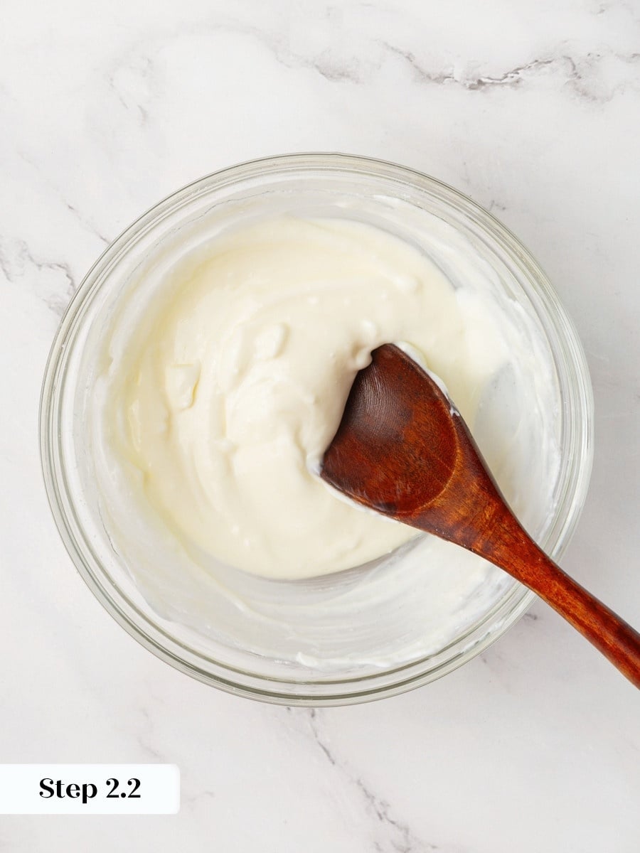 Filling this thick holds its shape when scooped, which centers it inside pumpkin cream cheese muffins.