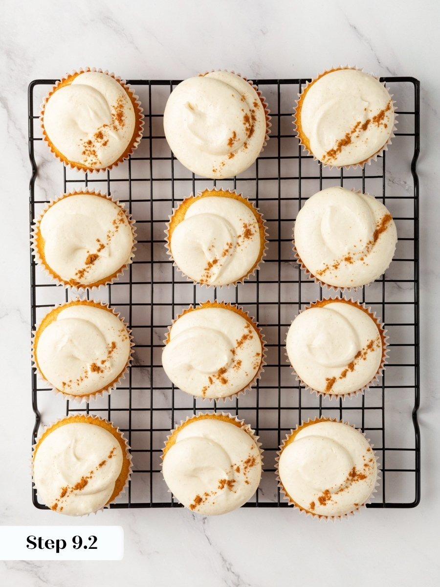 That final dusting echoes the spice inside pumpkin cupcakes with cream cheese frosting.