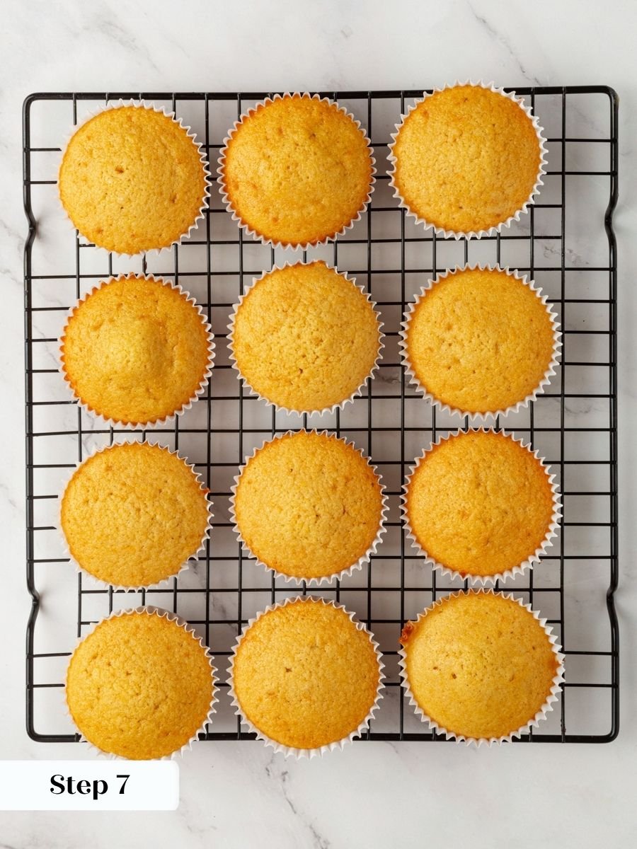 Leaving the tin immediately keeps edges of pumpkin cupcakes with cream cheese frosting firm.