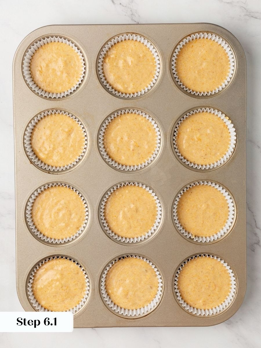 A cookie scoop keeps every one of these pumpkin cupcakes with cream cheese frosting identical.