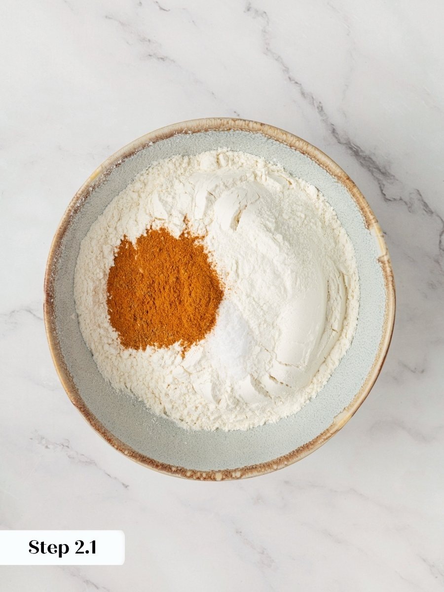 Measuring the spice blend first keeps pumpkin cupcakes with cream cheese frosting evenly warm throughout.