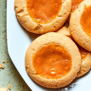 Shown as a group, these pumpkin pie cookies flaunt their signature spiced, custard-filled centers.