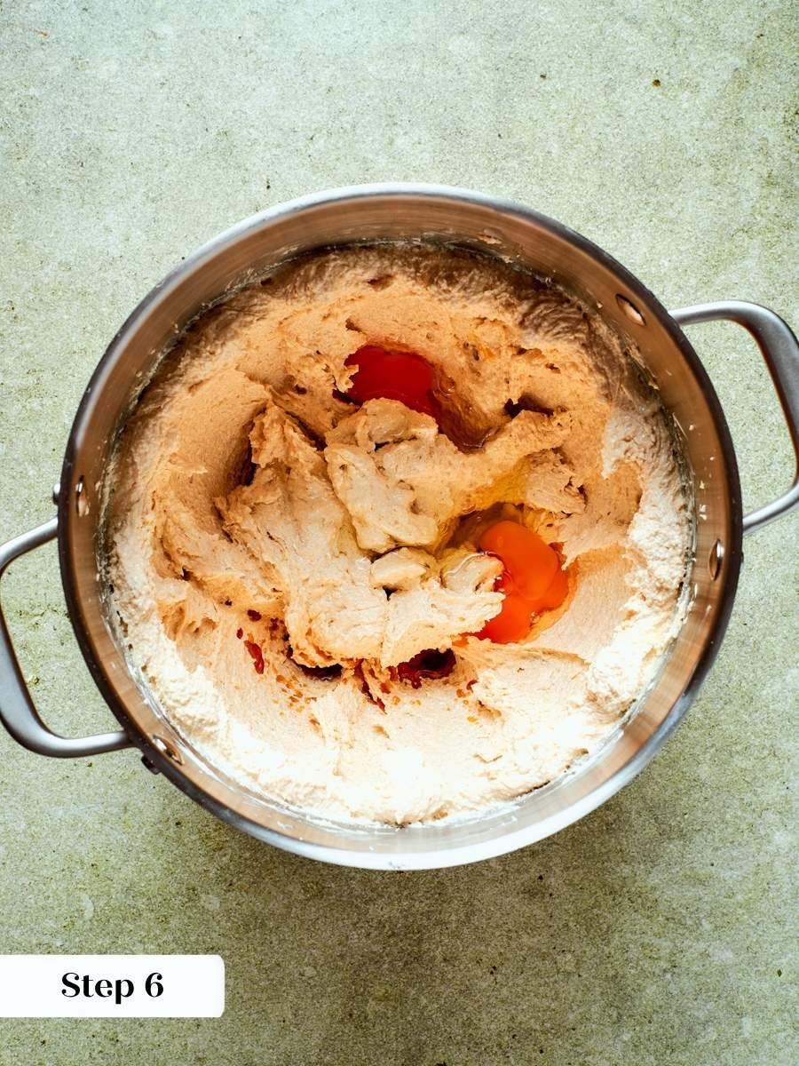 A curdled look here is normal and disappears as the pumpkin pie cookies dough comes together.