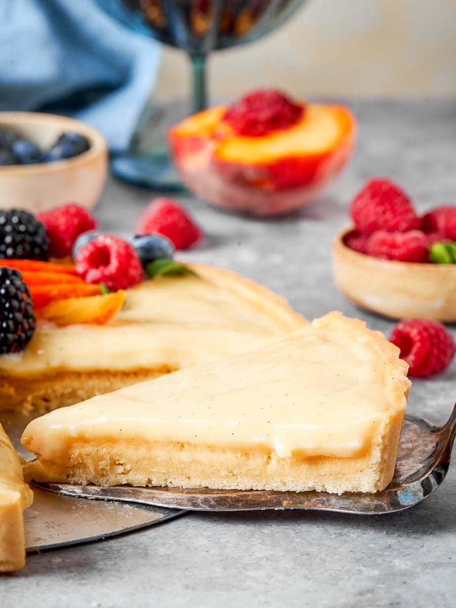 Serving from the side keeps the fruit tart layers legible rather than foreshortened.