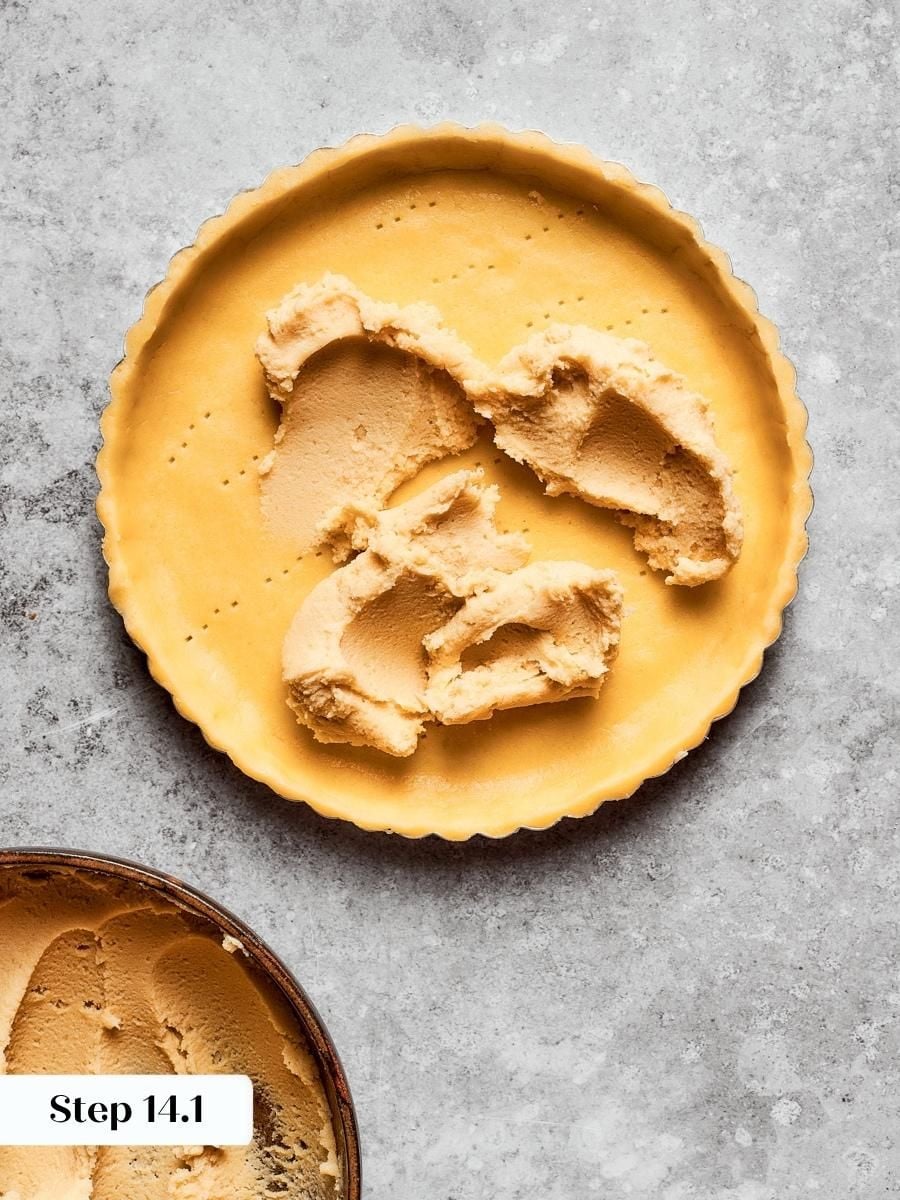 Spreading almond cream into raw dough lets both bake together into one seamless fruit tart base.