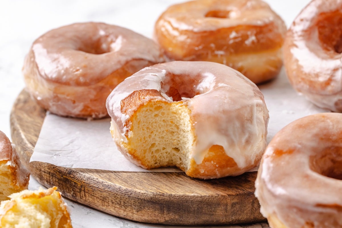Breaking one open shows the fine airy crumb hiding under every Krispy Kreme donut recipe glaze.