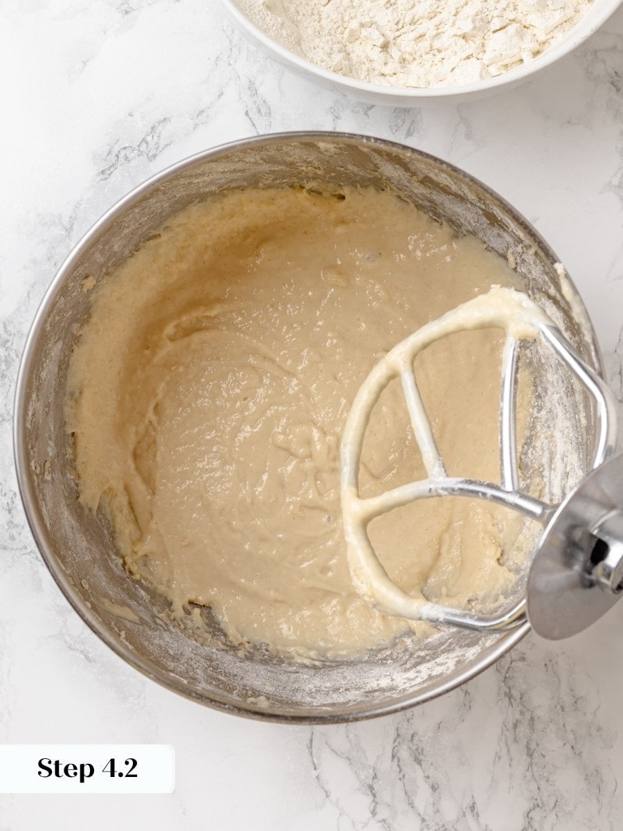 At this stage the mixture still pours; the Krispy Kreme donut recipe needs more flour yet.