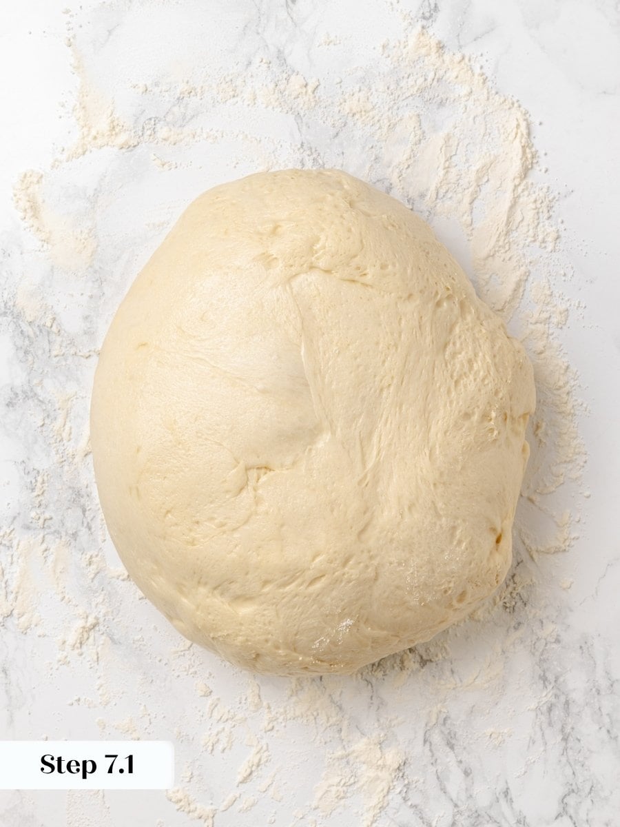 A bowl scraper moves the dough in one piece so the Krispy Kreme donuts keep rising.