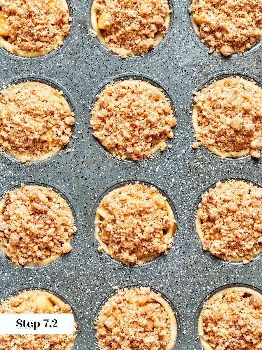 Distinct crumbs rather than a smooth cap keep mini apple pies crunchy after cooling.