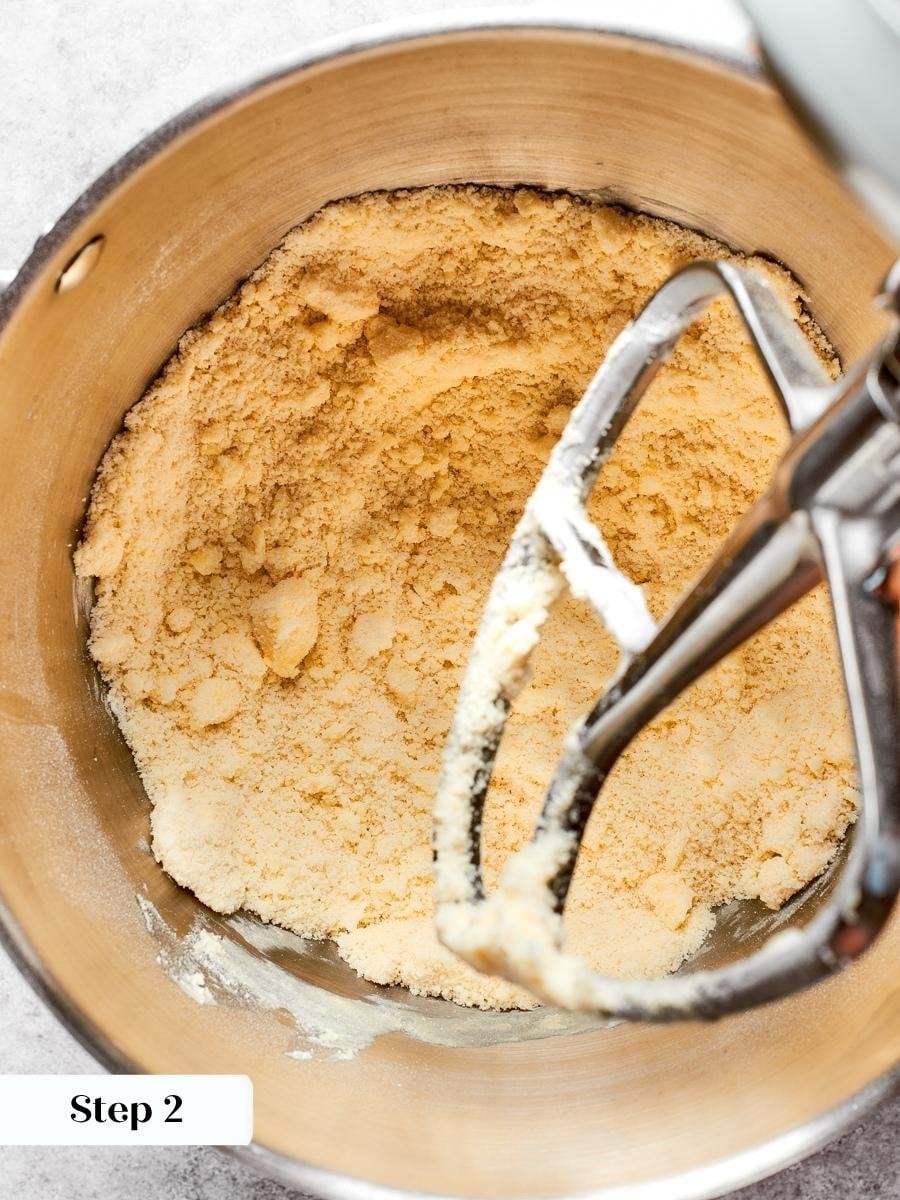 Cutting the butter in completely is the step that gives pâte sablée its short, tender crumb.