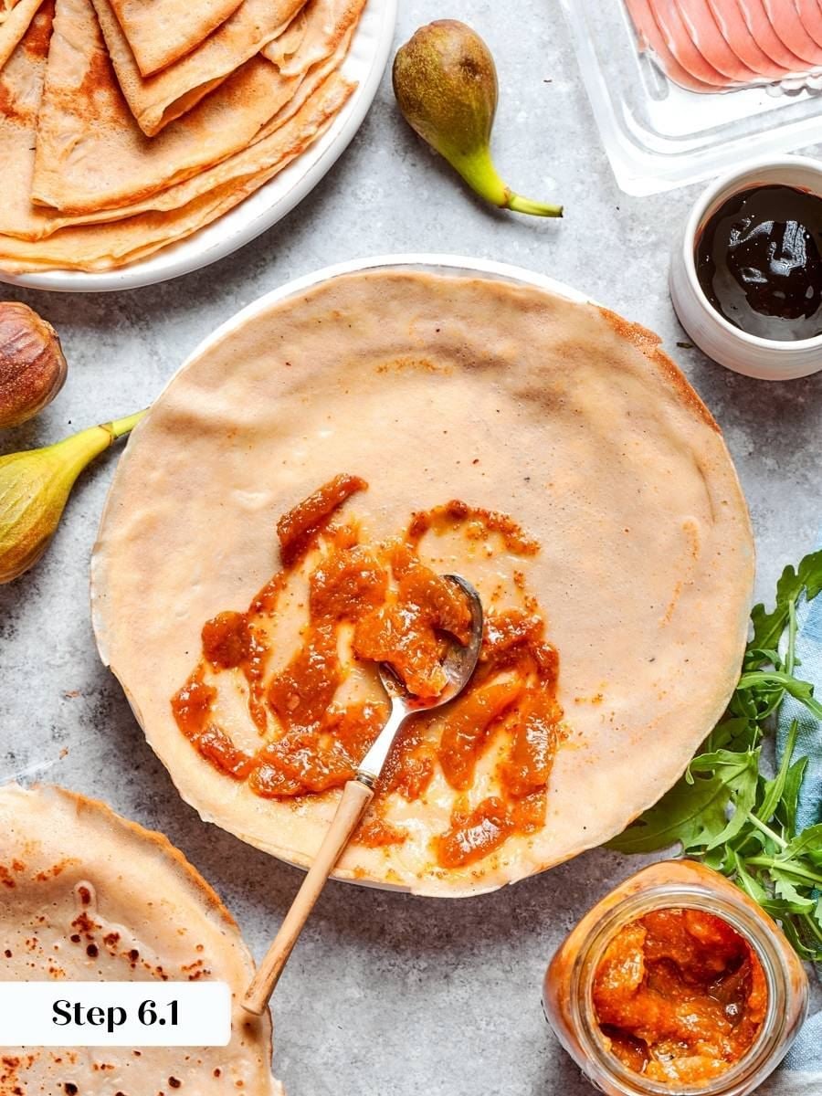 Sticky jam anchors what goes on top, so these savory crepes hold together when folded.