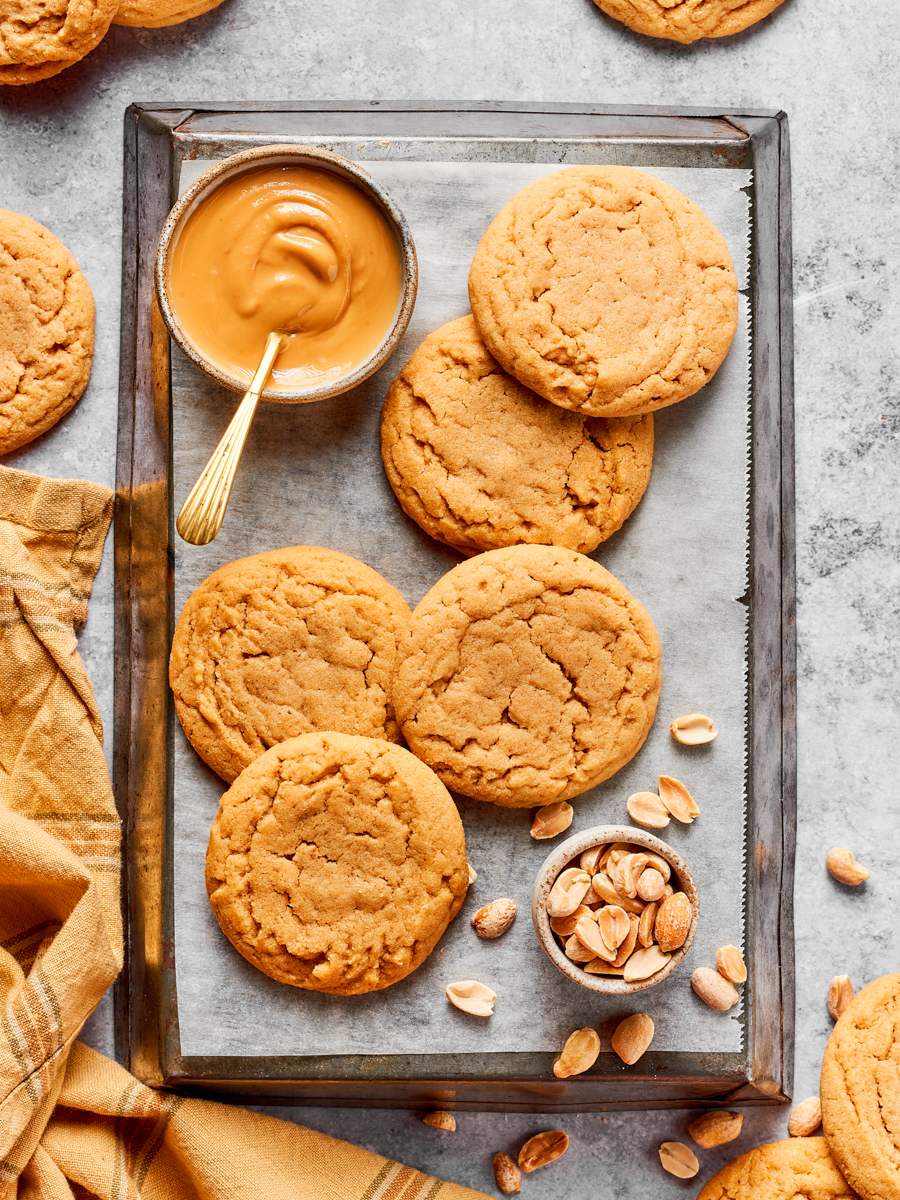 Served straight from the tray, chewy peanut butter cookies pair naturally with salted peanuts and coffee.