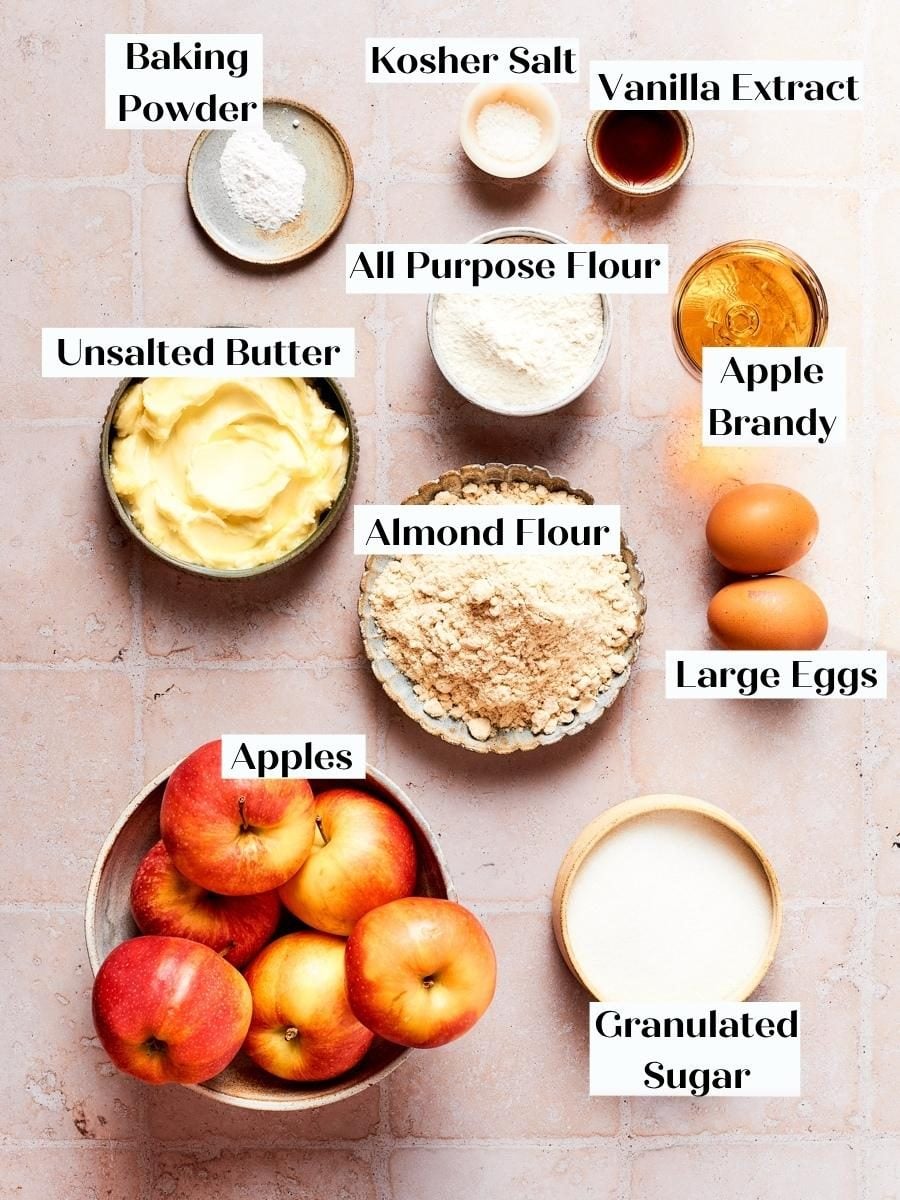 Gathered ingredients for french apple cake show the almond flour and apples central to this recipe.