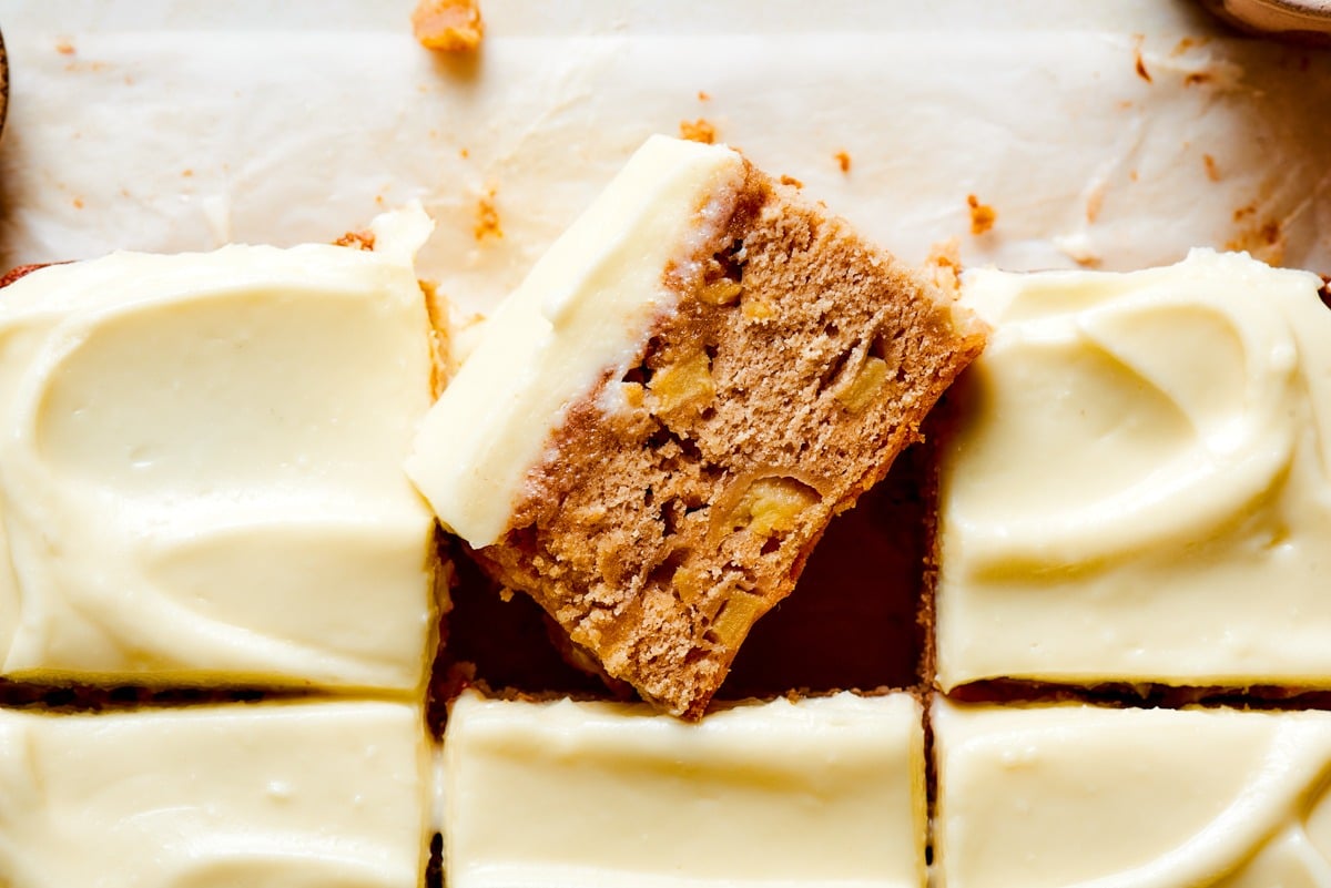 Finely diced apples stay suspended from top to bottom in each slice of gingerbread apple cake.