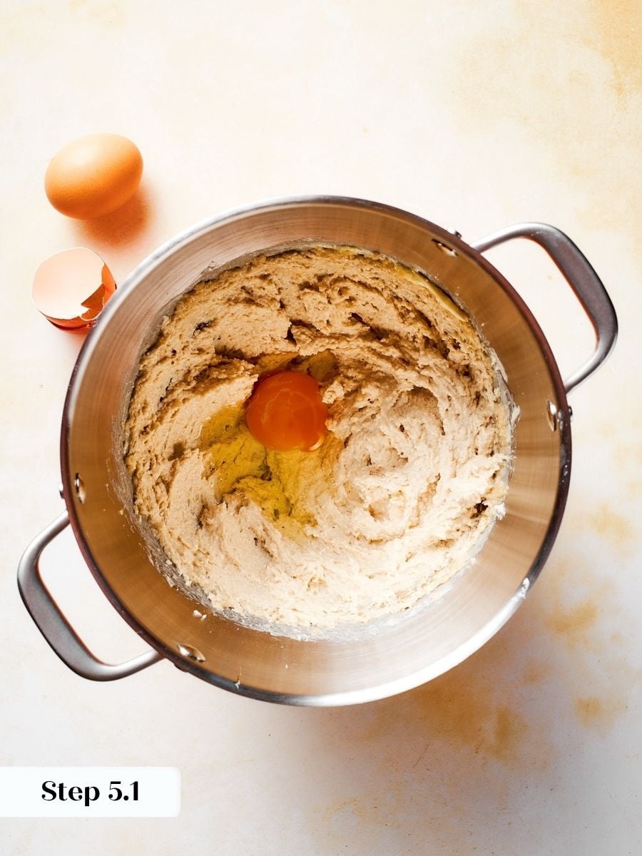 Adding eggs one at a time keeps this gingerbread apple cake batter smooth and cohesive.