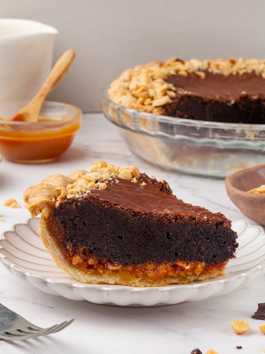 Four distinct layers of snickers pie stay sharp and clean when the pie is served cold.
