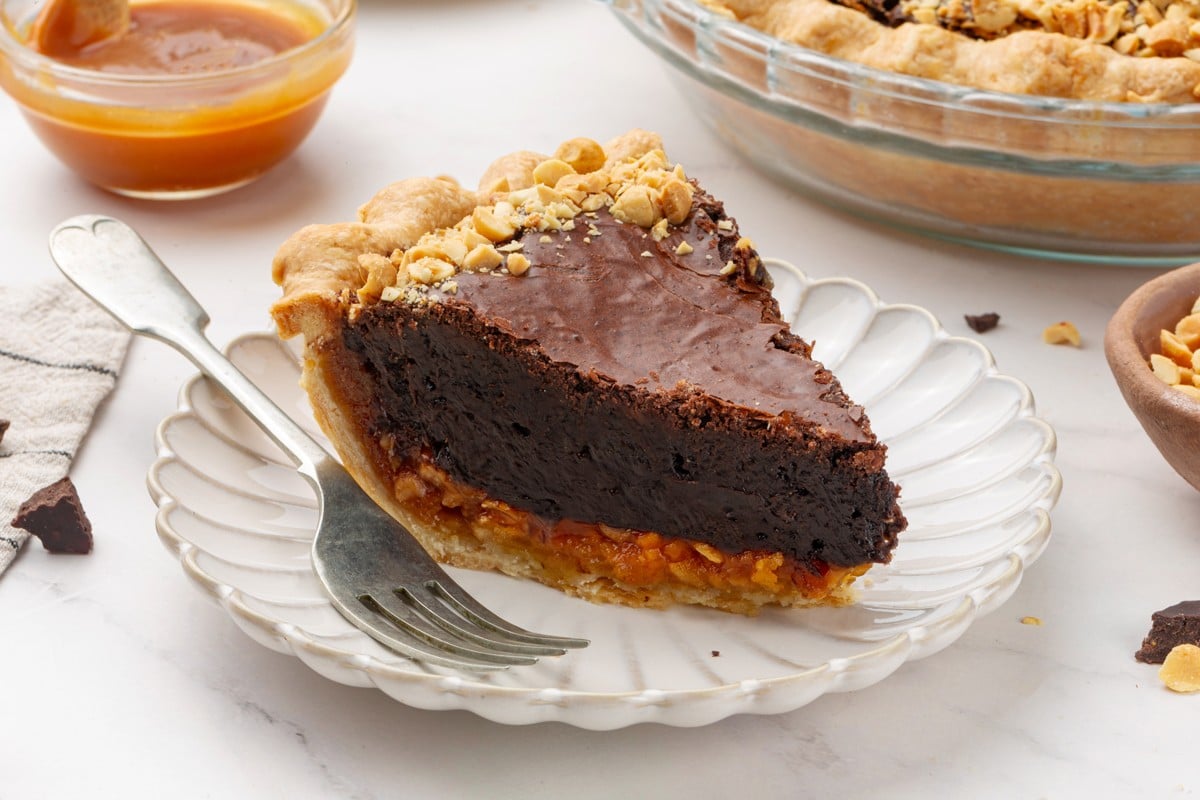 Rich chocolate filling, salted caramel, and peanuts make snickers pie a holiday favorite.