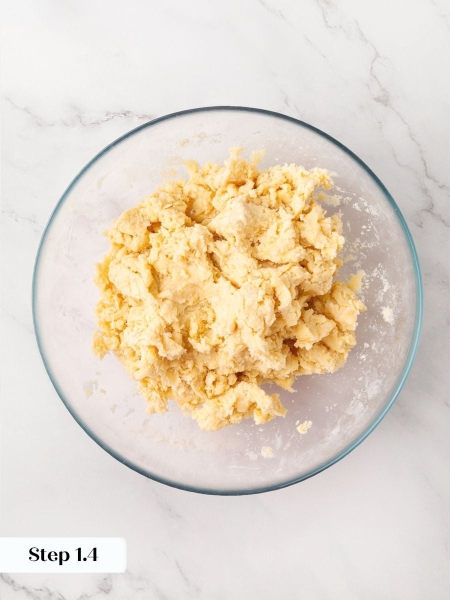 Stop adding water once the dough looks shaggy for a tender snickers pie crust.