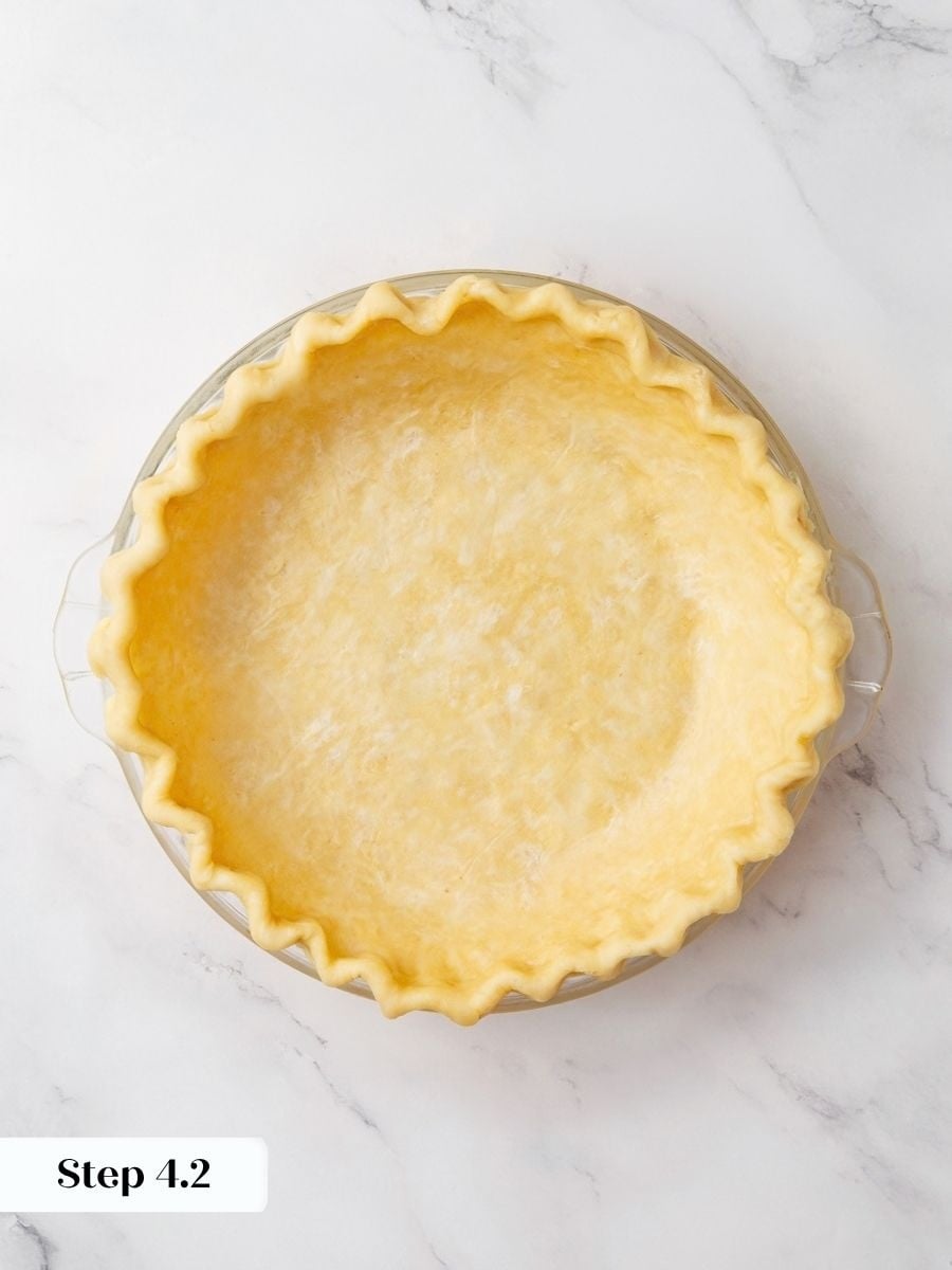 Fluting and chilling the shell helps the snickers pie crust keep its shape while baking.
