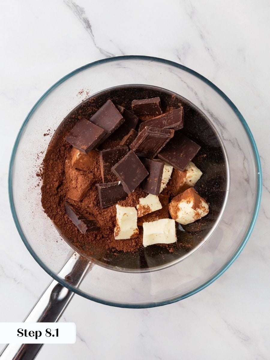 Gentle heat from barely simmering water melts the dark chocolate base of the snickers pie.