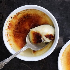 Torched to order, this vanilla creme brulee stays cold and creamy beneath its warm sugar top.