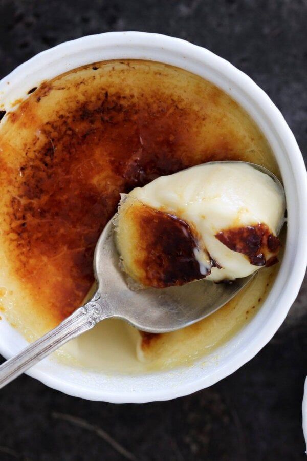 Torched to order, this vanilla creme brulee stays cold and creamy beneath its warm sugar top.
