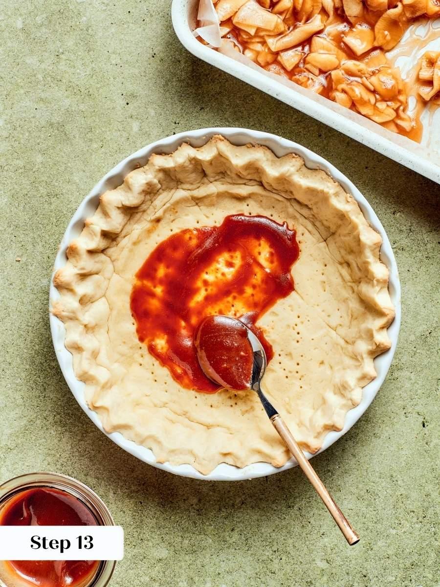Caramel spread over the warm crust forms the first layer of this caramel apple tart.