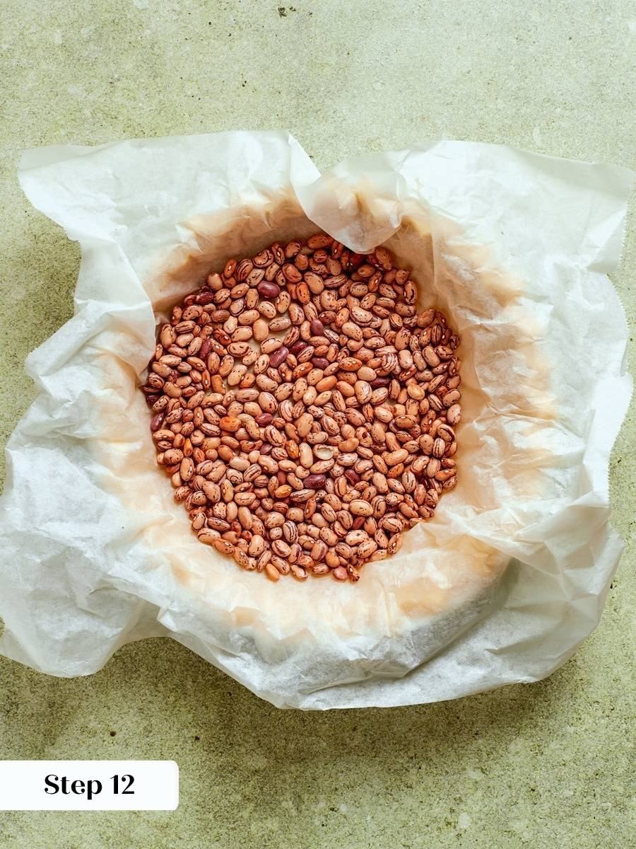 Blind baking sets the pâte sucrée so the caramel apple tart crust stays crisp underneath.