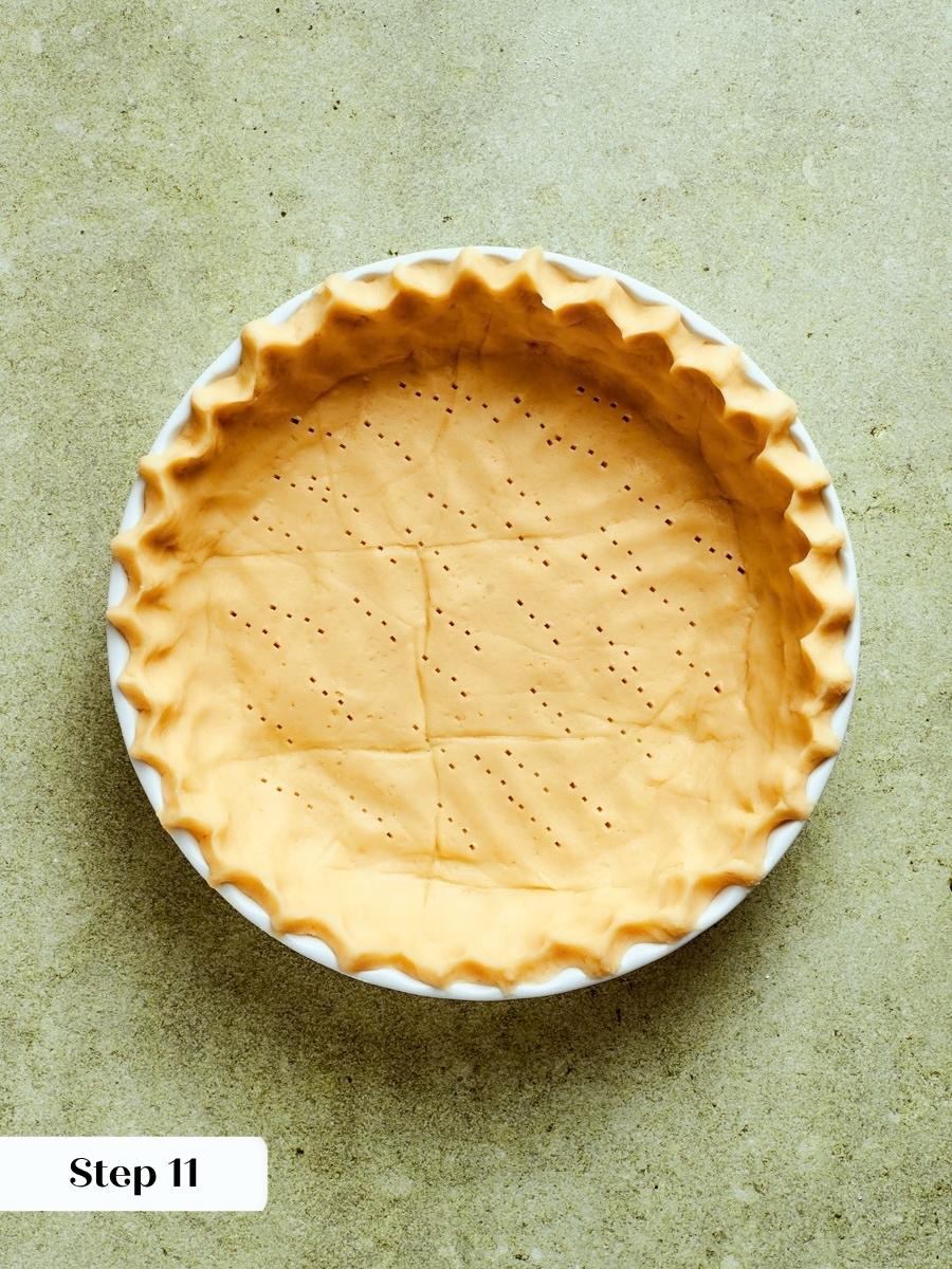 Lining the dish without stretching the dough helps the caramel apple tart shell hold its shape.