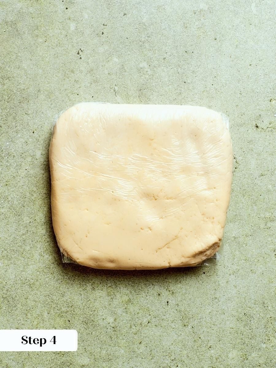 Wrapped pâte sucrée chills for two hours before it is rolled for the caramel apple tart.