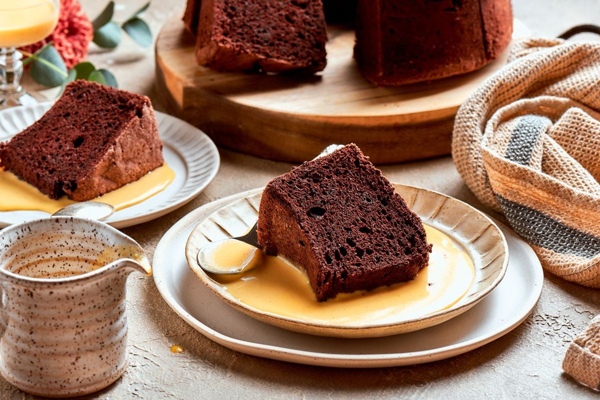 This chocolate angel food cake serves a crowd, with sliced portions and sauce to share.