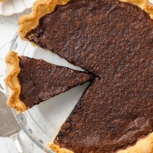 This Southern chocolate chess pie slices neatly once cooled, showing its cocoa custard and buttery rim.