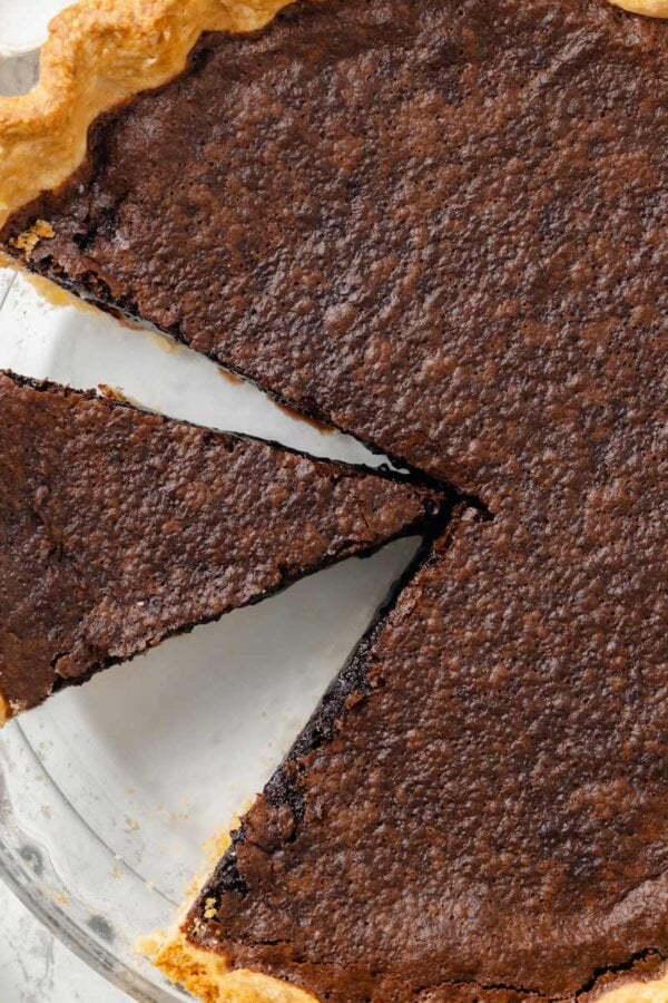 This Southern chocolate chess pie slices neatly once cooled, showing its cocoa custard and buttery rim.