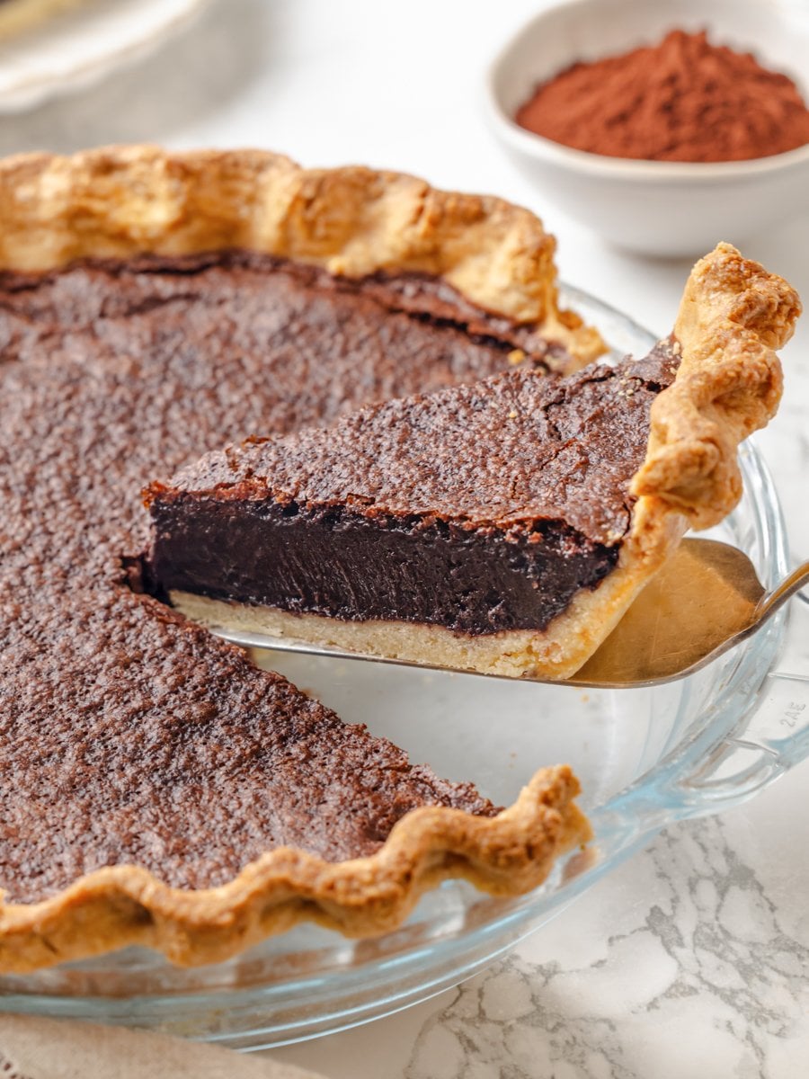 A clean wedge shows the parbaked sablée holding firm under the chocolate chess pie custard.