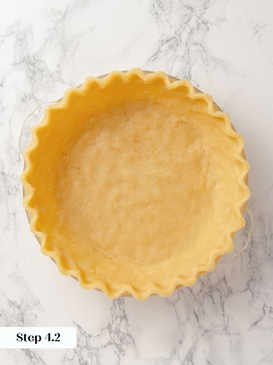 Chilling the lined shell before baking keeps the chocolate chess pie crust holding its crimped shape.