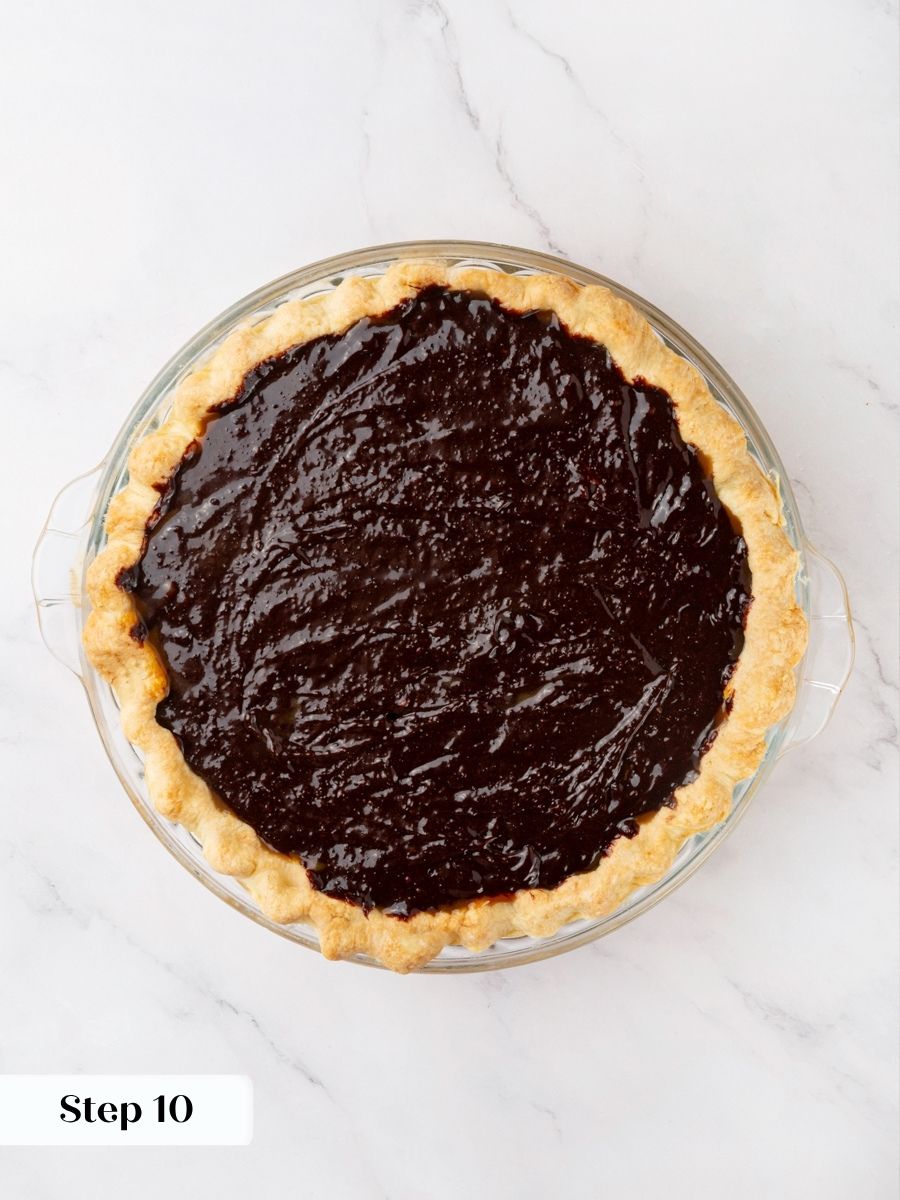 Once poured, the chocolate fudge pie bakes until the center puffs and jiggles as one.