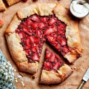 Each wedge of strawberry galette holds diced and sliced berries over a chocolate frangipane layer.