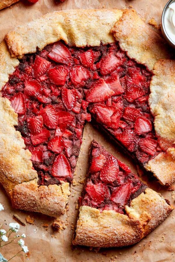Each wedge of strawberry galette holds diced and sliced berries over a chocolate frangipane layer.
