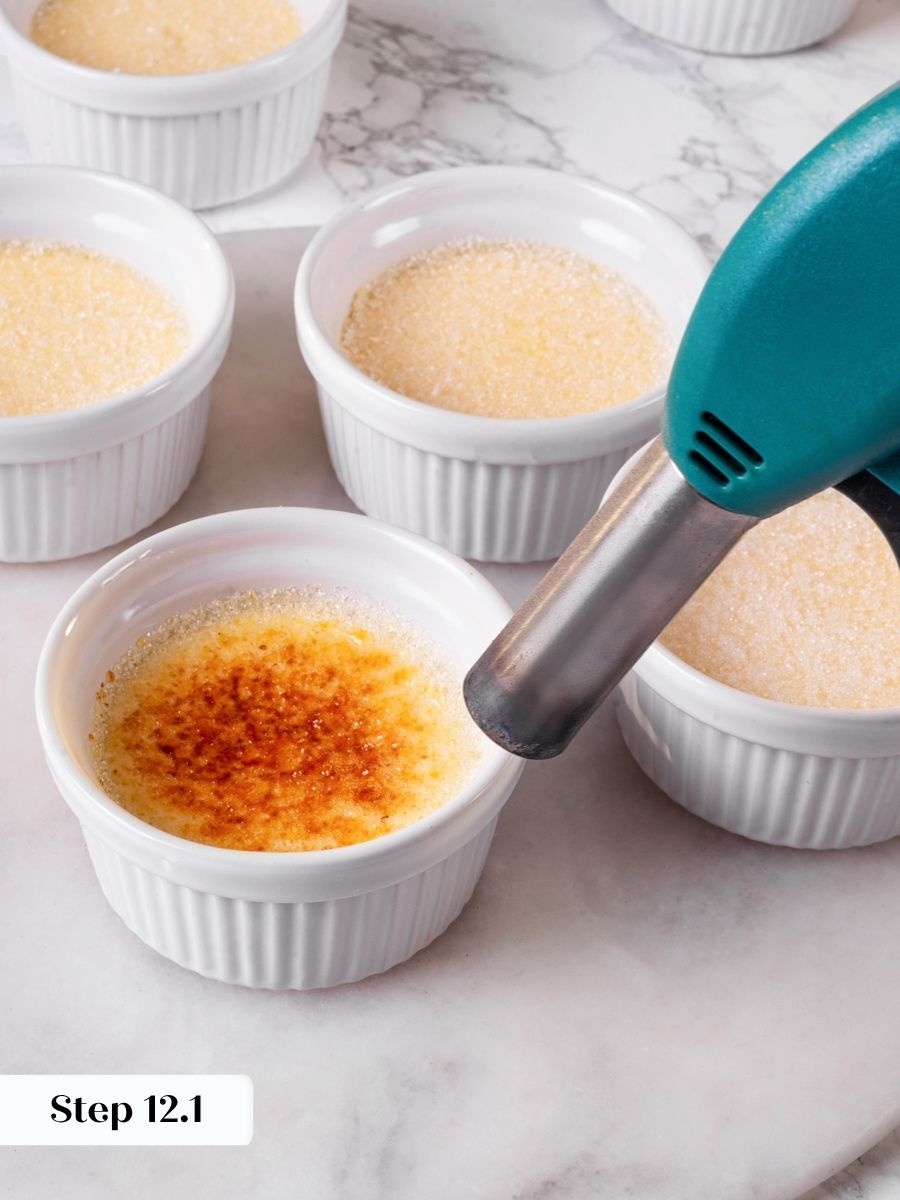 Starting the torch low and far away helps vanilla creme brulee caramelize without scorching.