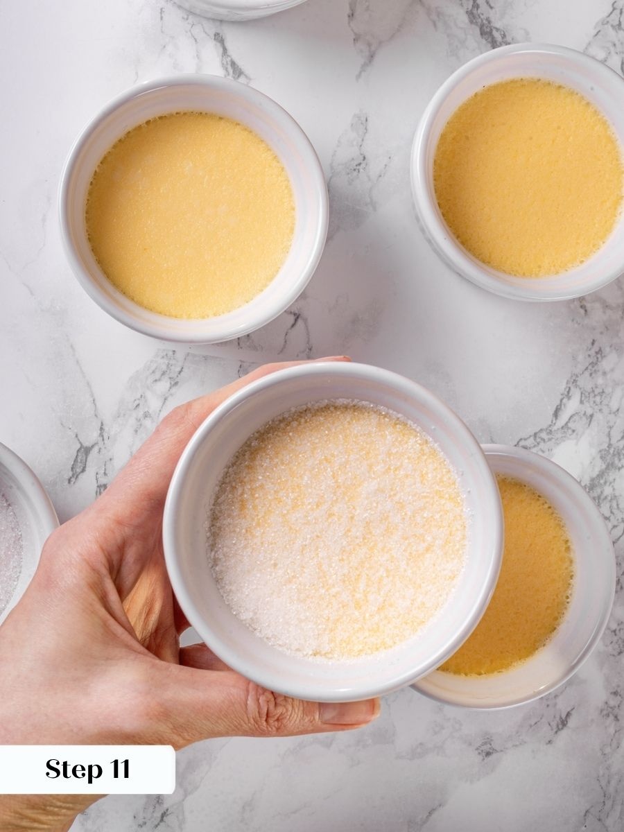 Tilting to spread the sugar evenly prevents bare patches from burning on vanilla creme brulee.